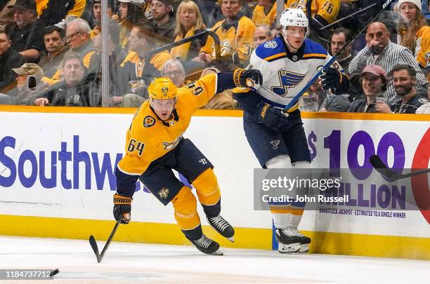 Mikael Granlund of the Nashville Predators skates against Jacob de la Rose of the St. Louis Blues at Bridgestone Arena on November 25, 2019 in...