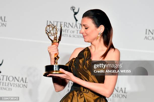 Hungarian actress Marina Gera poses in the press room with the award for "Best Performance by an Actress" for "Orok Tel" during the 47th Annual...