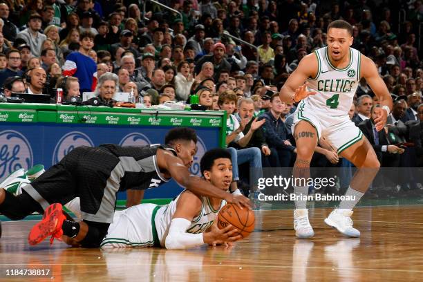 Yogi Ferrell of the Sacramento Kings and Tremont Waters of the Boston Celtics go after the ball during the game against the Sacramento Kings on...