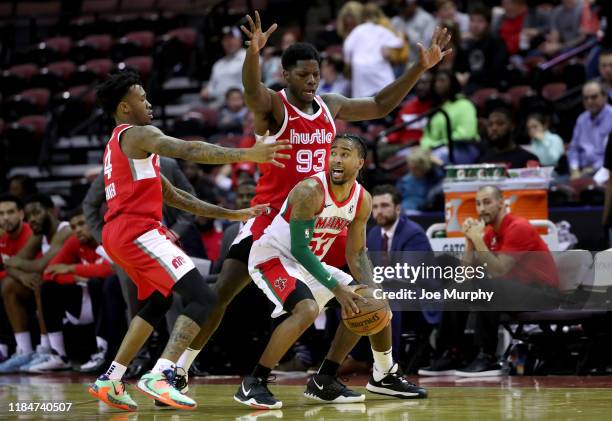 Trey Davis of the Maine Red Claws looks to pass against Nino Johnson of the Memphis Hustle during an NBA G-League game on November 25, 2019 at...