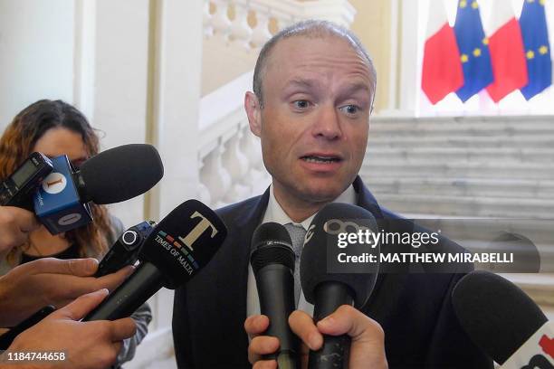 An image grabbed from a video shows Malta's Prime Minister, Joseph Muscat addressing the media at his office in Castille, Valletta, announcing that...