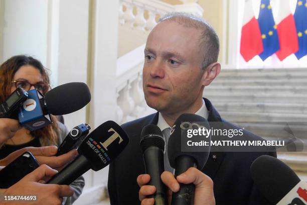 An image grabbed from a video shows Malta's Prime Minister, Joseph Muscat addressing the media at his office in Castille, Valletta, announcing that...