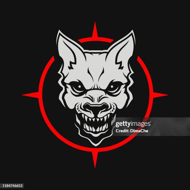 angry dog or wolf head cut out silhouette. growling mad dog with open mouth - stylized mascot on a dark background - demon fictional character stock illustrations