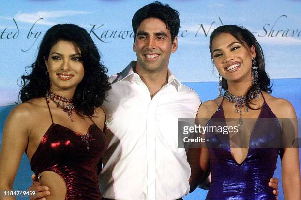 Bollywood actor Akshay Kumar poses with Lara Dutta and Priyanka Chopra during the launch of the soundtrack of the Hindi movie "Andaaz" in Bombay,...