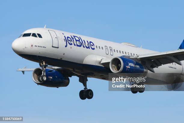 JetBlue Airways Airbus A320-200 aircraft as seen on final approach landing at New York John F. Kennedy International Airport in USA. The airplane has...