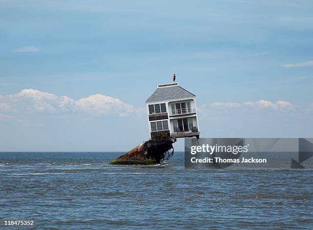 house perched above flood - flood bildbanksfoton och bilder