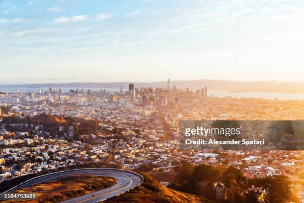 panoramic view of san francisco skyline at sunrise seen from twin peaks, california, usa - twin peaks stock pictures, royalty-free photos & images