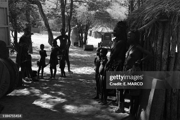 Villagers of the Hima tribe pose in December 1975, on the Kunene River side, during the Angolan Civil War. MPLA fought against the Portuguese army in...