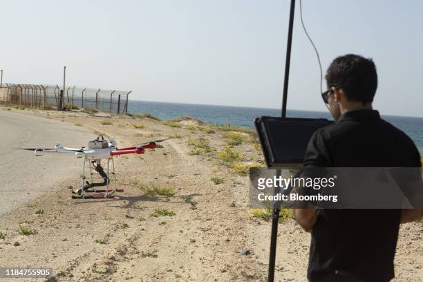 Drone pilot demonstrates the operation of a Gaia 190 military drone capable of dismantling bombs with its robotic arm during a media demonstration by...