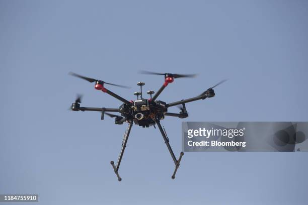 An Israeli DJI Matrice 600 Pro military drone used for bringing down incendiary balloons and kites flown from Gaza flies during a media demonstration...