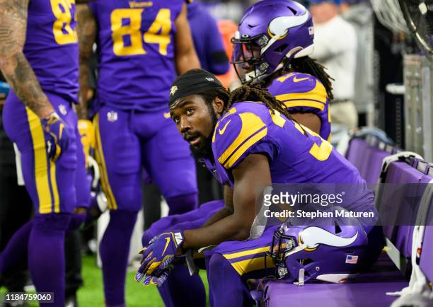 Dalvin Cook of the Minnesota Vikings sits on the bench after scoring a touchdown in the second quarter of the game against the Washington Redskins at...
