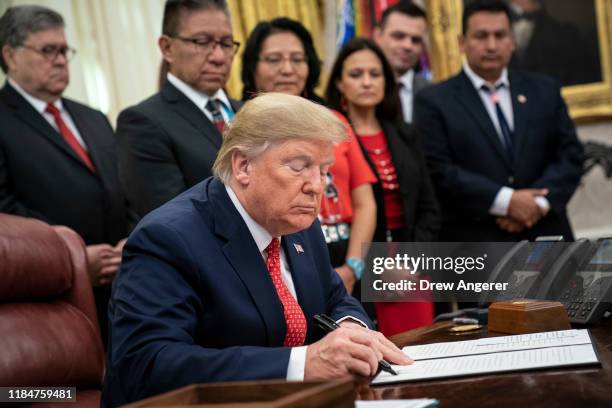 President Donald Trump signs an executive order establishing the Task Force on Missing and Murdered American Indians and Alaska Natives, in the Oval...