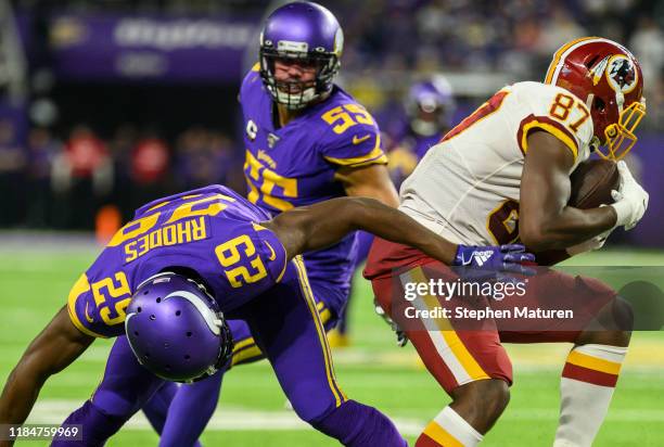 Jeremy Sprinkle of the Washington Redskins spins with the ball away from defender Xavier Rhodes of the Minnesota Vikings in the third quarter of the...