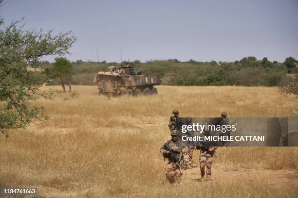 Soldiers of the French Army monitors a rural area during the Barkhane operation in northern Burkina Faso on November 12, 2019.