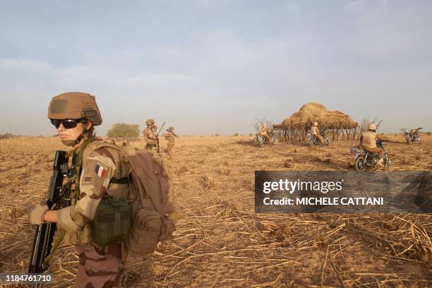 Soldier of the French Army patrols a rural area during the Barkhane operation in northern Burkina Faso on November 9, 2019.