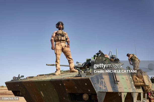 Judickael a driver, poses for a portrait on an Armoured Personnel Carrier of the French Army during the Barkhane operation in northern Burkina Faso...