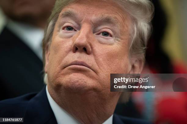 President Donald Trump looks on during a signing ceremony for an executive order establishing the Task Force on Missing and Murdered American Indians...