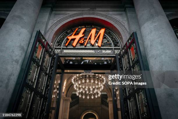 The H&M logo, the Swedish chain of clothing and accessories stores, seen at the Passeig de Gràcia store. A boulevard of just over a kilometre, the...