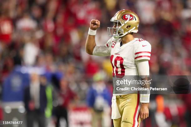 Quarterback Jimmy Garoppolo of the San Francisco 49ers celebrates after throwing a 21 yard touchdown reception to Dante Pettis during the second half...