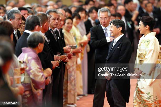 Emperor Naruhito and Empress Masako talk with guests during the 'Kyoen-no-Gi' banquet celebrating the enthronement at the Imperial Palace on October...