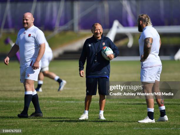 England's head coach Eddie Jones with Joe Marler and Dan Cole during the England training session at Fuchu Asahi Football Park on November 1, 2019 in...