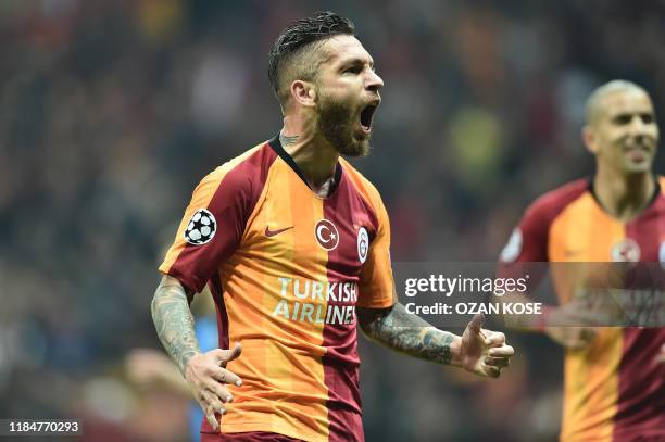 Galatasaray's Turkish midfielder Adem Buyuk celebrates after scoring a goal during the UEFA Champions League football match between Galatasaray and...