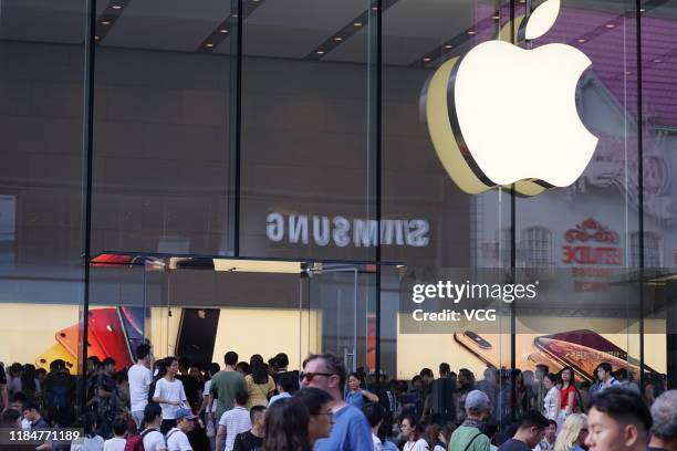 People walk by an Apple store opposite a Samsung store on September 13, 2019 in Shanghai, China.