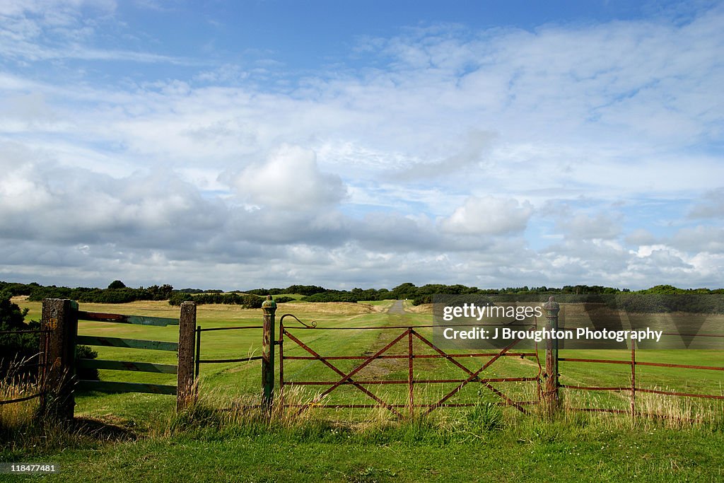 Rural landscape with metal gate