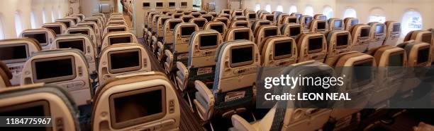General view of the interior of the economy class area of the Singapore Airlines Airbus A380 at London's Heathrow Airport in west London, on March...
