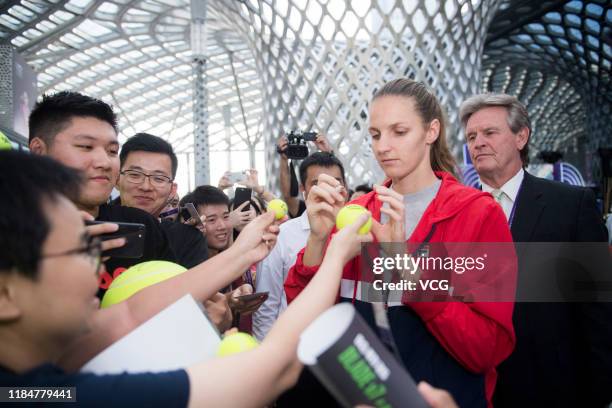 Karolina Pliskova of the Czech Republic signs autograph on a tennis ball during Wuliangye event on Day five of the 2019 WTA Finals at Shenzhen Bay...