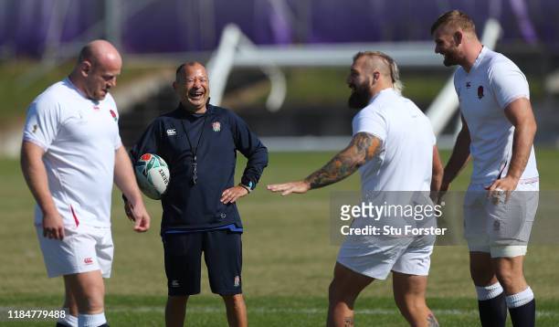 England coach Eddie Jones shares a joke with Joe Marler as Dan Cole and George Kruis look on during England captains run ahead of the 2019 Rugby...