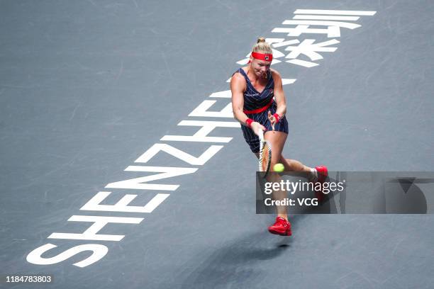 Kiki Bertens of the Netherlands competes in the Women's Singles group match against Belinda Bencic of Switzerland on Day five of the 2019 WTA Finals...