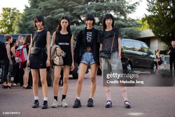 Chinese models Pan Haowen, Qun Ye, Ruinan Dong, and Jing Huang after the Miu Miu Resort 2020 show on June 29, 2019 in Paris, France. Pan Haowen wears...