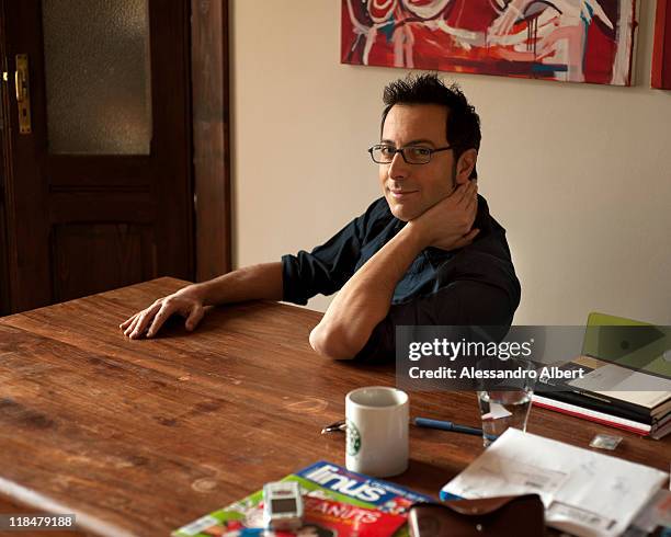 Italian writer Luca Bianchini poses during a portraits session held in his home in Turin on January 25, 2011 in Turin, Italy.