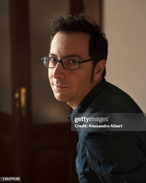 Italian writer Luca Bianchini poses during a portraits session held in his home in Turin on January 25, 2011 in Turin, Italy.