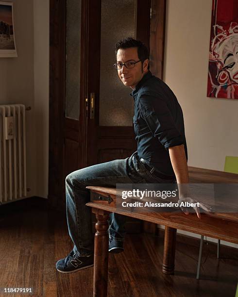 Italian writer Luca Bianchini poses during a portraits session held in his home in Turin on January 25, 2011 in Turin, Italy.