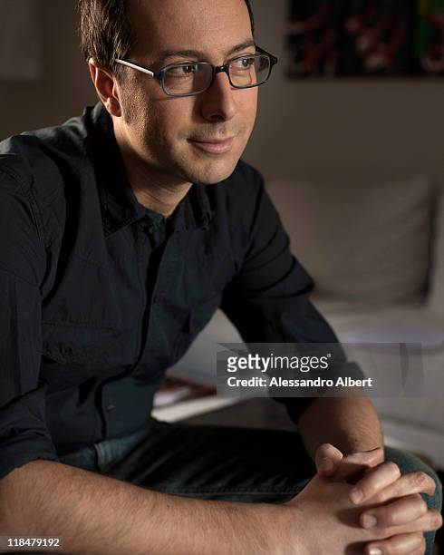 Italian writer Luca Bianchini poses during a portraits session held in his home in Turin on January 25, 2011 in Turin, Italy.