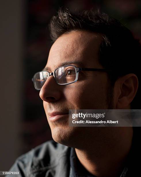 Italian writer Luca Bianchini poses during a portraits session held in his home in Turin on January 25, 2011 in Turin, Italy.