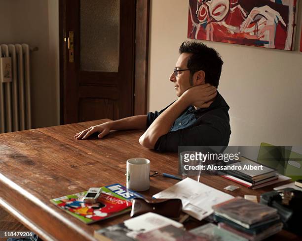 Italian writer Luca Bianchini poses during a portraits session held in his home in Turin on January 25, 2011 in Turin, Italy.