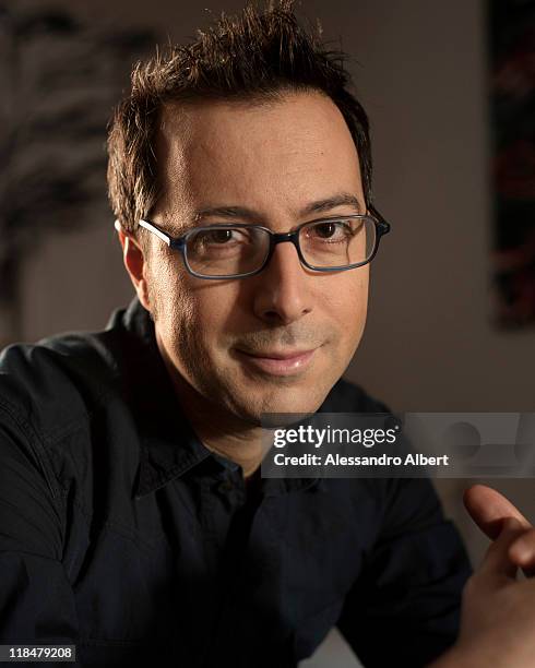 Italian writer Luca Bianchini poses during a portraits session held in his home in Turin on January 25, 2011 in Turin, Italy.