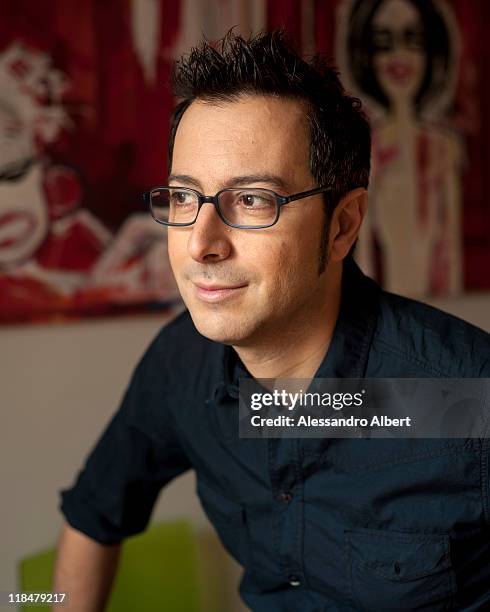 Italian writer Luca Bianchini poses during a portraits session held in his home in Turin on January 25, 2011 in Turin, Italy.