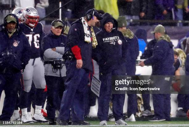 New England Patriots special teams coordinator / wide receivers coach Joe Judge speaks with New England Patriots head coach Bill Belichick during a...