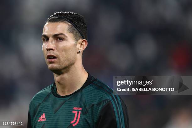 Juventus' Portuguese forward Cristiano Ronaldo warms up prior to the UEFA Champions League Group D football match Juventus Turin vs Atletico Madrid...