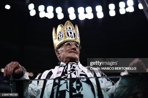 Fan of Juventus attends the UEFA Champions League Group D football match Juventus Turin vs Atletico Madrid on November 26, 2019 at the Juventus...