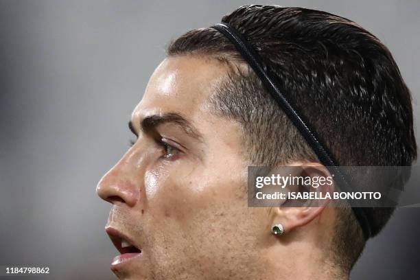 Juventus' Portuguese forward Cristiano Ronaldo looks on as he warms up prior to the UEFA Champions League Group D football match Juventus Turin vs...