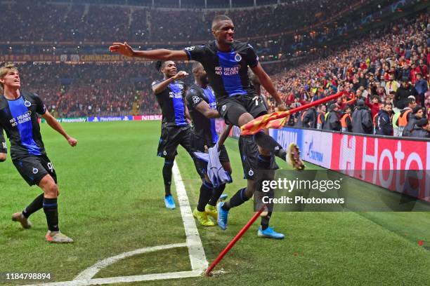 Clinton Mata defender of Club Brugge kicks the corner flag as Krepin Diatta forward of Club Brugge celebrates scoring the equalising goal with...