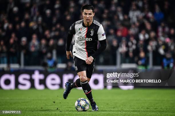 Juventus' Portuguese forward Cristiano Ronaldo controls the ball during the UEFA Champions League Group D football match Juventus Turin vs Atletico...