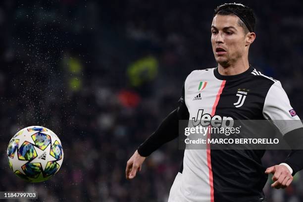 Juventus' Portuguese forward Cristiano Ronaldo eyes the ball during the UEFA Champions League Group D football match Juventus Turin vs Atletico...