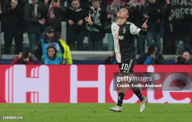 Paulo Dybala of Juventus celebrates after scoring the opening goal during the UEFA Champions League group D match between Juventus and Atletico...