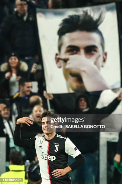Juventus' Argentine forward Paulo Dybala celebrates after opening the scoring during the UEFA Champions League Group D football match Juventus Turin...
